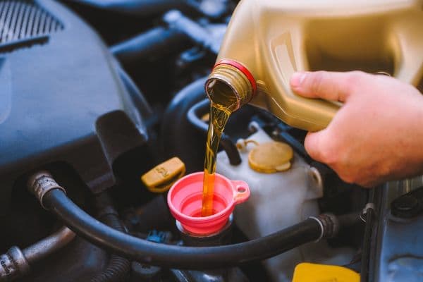 Mechanic conducting a tune up on a vehicle
