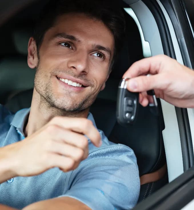 Happy Newby's Automotive customer receiving their keys